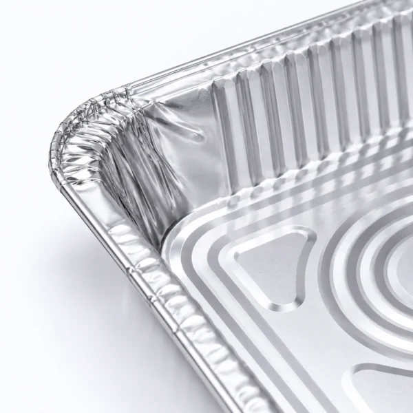 Close-up of the rim, corner and wrinklewall structure of the aluminum foil steam table pan