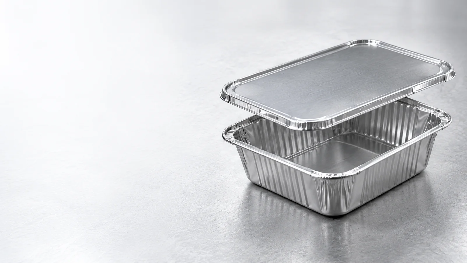 Aluminum foil containers being formed on an industrial production line