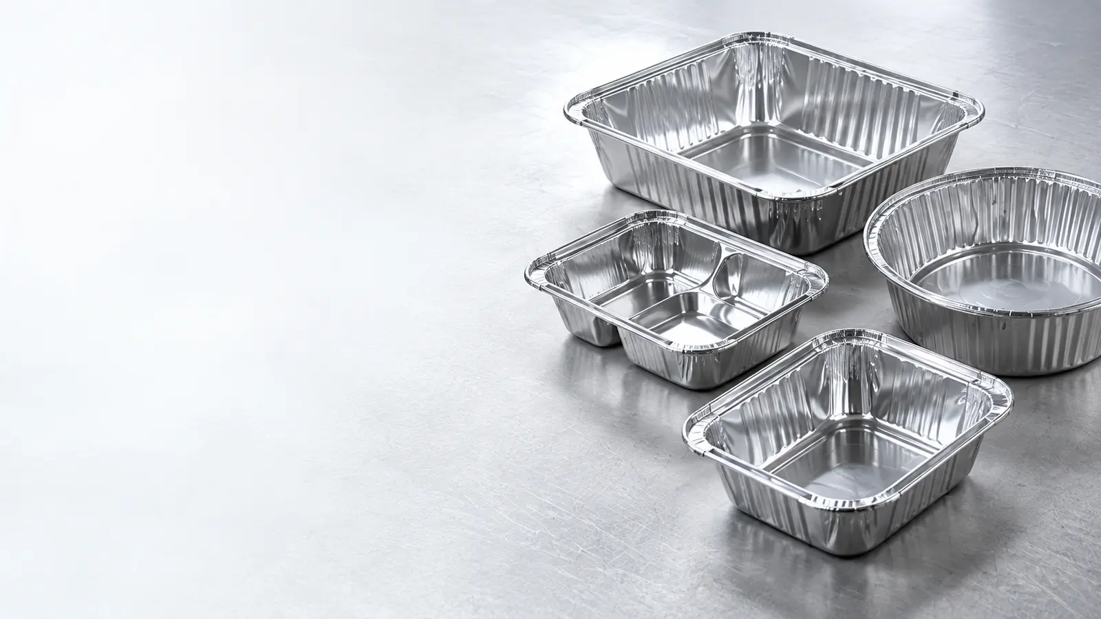 Aluminum foil containers being formed on an industrial production line