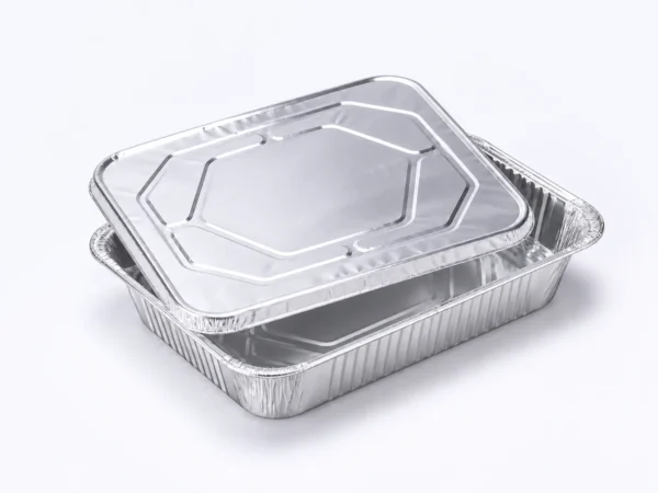 Half size aluminum foil steam table pan lid shown with compatible steam table pan