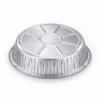 Upside-down view of the round aluminum foil pan showing its circular embossed base and textured outer walls.