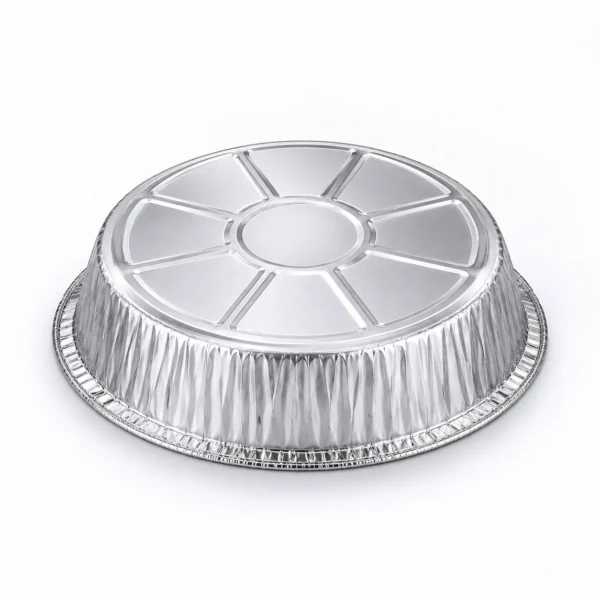 Upside-down view of the round aluminum foil pan showing its circular embossed base and textured outer walls.